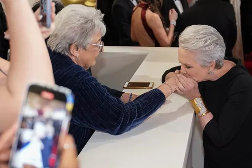 Jamie Lee Curtis, right, arrives at the Oscars on Sunday, March 10, 2024, at the Dolby Theatre in Los Angeles. (AP Photo/John Locher)