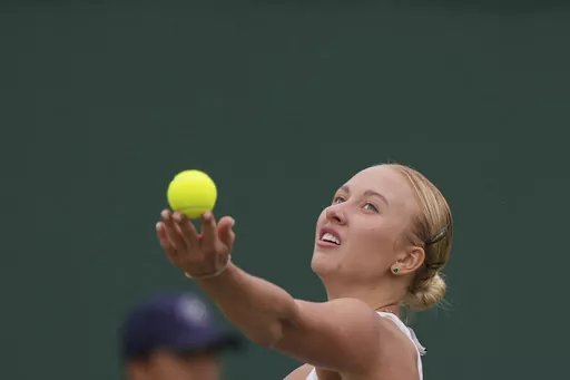 Russia's Anastasia Potapova serves to Russia's Mirra Andreeva during the women's singles match on day seven of the Wimbledon tennis championships in London, Sunday, July 9, 2023. (AP Photo/Alberto Pezzali)