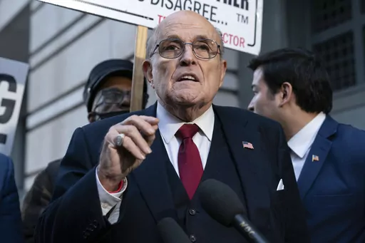 Former Mayor of New York Rudy Giuliani speaks during a news conference outside the federal courthouse in Washington, Friday, Dec. 15, 2023. Giuliani has filed for bankruptcy, days after being ordered to pay $148 million in a defamation lawsuit. (AP Photo/Jose Luis Magana, File)