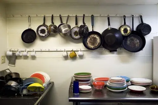 Pots and pans for use at the Venice Hostel are placed near a sink in Venice Beach, Los Angeles, Aug. 14, 2009. Airbnb may have met its match. There’s no shortage of customers who have sworn off the company after being ghosted by owners or hit with unexpected cleaning fees. Airbnb’s operation in New York City is severely restricted, given new regulations implemented in 2023. Meanwhile, hostels — which largely struggled during the pandemic amid concerns about sharing rooms — are back. (AP 