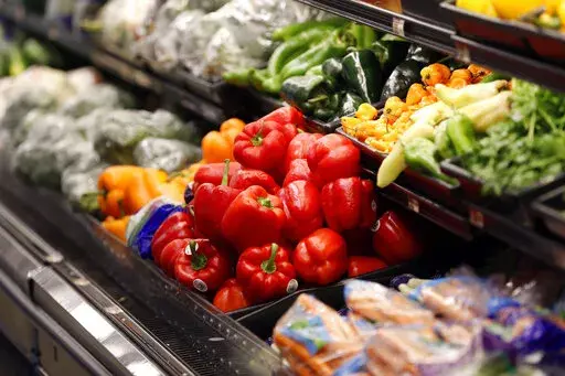 Vegetables are displayed for sale at a grocery store in River Ridge, La., Wednesday, July 11, 2018. On Thursday, Nov. 17, 2022, U.S. agriculture officials proposed changes to the federal program that helps pay the grocery bills for pregnant women, babies and young children that includes keeping a bump in payments for fresh fruits and vegetables allowed during the COVID-19 pandemic. (AP Photo/Gerald Herbert, File)