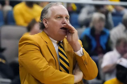 Southern Mississippi head coach Jay Ladner calls out to his team during the first half of an NCAA college basketball game against Mississippi, Saturday, Dec. 23, 2023, in Biloxi, Miss. Southern Mississippi coach Jay Ladner was hospitalized Tuesday morning, Feb. 6, 2024 after suffering what the school described as a “heart-related medical emergency.” (AP Photo/Rogelio V. Solis, File)