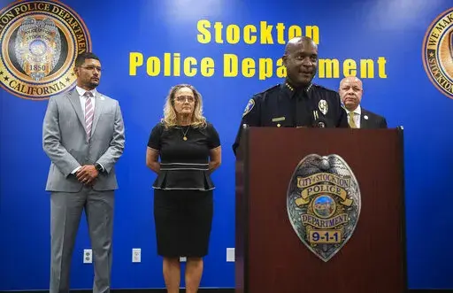 Stockton Police Chief Stanley McFadden speaks during a news conference at the Stockton Police Department headquarters about the arrest of suspect Wesley Brownlee in a series of killings in Stockton, Calif., Saturday, Oct. 15, 2022. Pictured behind McFadden are Stockton Mayor Kevin Lincoln, left, San Joaquin County District Attorney Tori Veber Salazar and Stockton city manager Harry Black. (Clifford Oto/The Record via AP)
