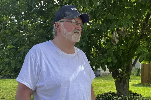 Rick Satterwhite, 62, eyes rising water from the Missouri River as it creeps closer to the house where he grandchildren live in South Sioux City, Neb., on Monday, June 24, 2024. Satterwhite says he's planning to get flood insurance for his own house also located by the river in nearby Dakota City, Nebraska, after floodwaters came within feet of his home this week. (AP Photo/Margery Beck)