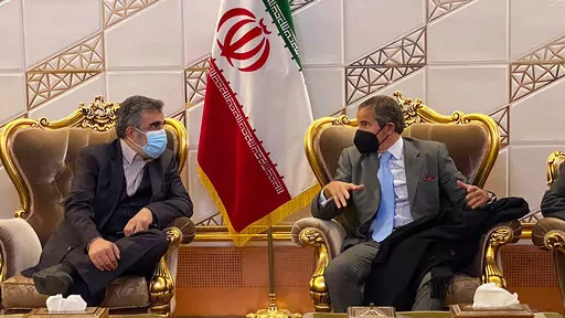 Director General of International Atomic Energy Agency, IAEA, Rafael Mariano Grossi, right, speaks with deputy head of the Atomic Energy Organization of Iran Behrouz Kamalvandi at Imam Khomeini Airport, in Tehran, Iran, Nov. 22, 2021. Iran announced Sunday, July 10, 2022, that it has begun enriching uranium up to 20% using sophisticated centrifuges at its underground Fordo nuclear plant, state TV reported, an escalation that comes amid a standoff with the West over its tattered atomic deal. Kama