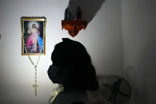 Hasini Wasana, a renal transplant patient, sits in her home in Negombo, outskirts of Colombo, Sri Lanka, June 19, 2022. Wasana had been diagnosed with a kidney ailment as a toddler and underwent a transplant nine months ago. She has to take a tablet for lifetime, an immunosuppressant to stop her body from rejecting the transplanted kidney. The government has no dollars to import them  and Wasana's family is dependent on donors because is too expensive in the private sector. Sri Lanka is bankrupt