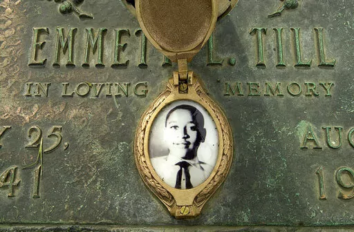 In this May 4, 2005 file photo, Emmett Till's photo is seen on his grave marker in Alsip, Ill. Legislation that would make lynching a federal hate crime in the U.S. is expected to be signed into law next week by President Joe Biden. The Emmett Till Anti-Lynching Act was years in the making. (Robert A. Davis/Chicago Sun-Times via AP, File)