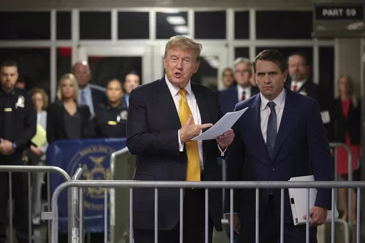 Former President Donald Trump speaks alongside his attorney Todd Blanche following the day's proceedings in his trial Tuesday, May 21, 2024, in Manhattan Criminal Court in New York. (Michael M. Santiago/Pool Photo via AP)