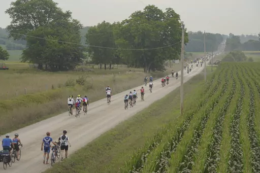 Riders take a gravel detour outside Colfax, Iowa, as RAGBRAI 50 heads to Tama-Toledo on Thursday, July 27, 2023. (Zach Boyden-Holmes/The Des Moines Register via AP)