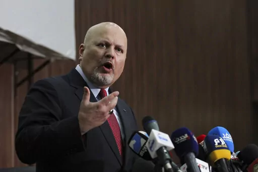 Karim Ahmed Khan, International Criminal Court chief prosecutor, speaks during a news conference at the Ministry of Justice in the Khartoum, Sudan, Aug. 12, 2021. Representatives of a group of nations working together to investigate war crimes committed since Russia's invasion of Ukraine are meeting Tuesday, May 31, 2022 in The Hague amid ongoing calls for those responsible for atrocities to be brought to justice. Tuesday's coordination meeting at the European Union's judicial cooperation agency