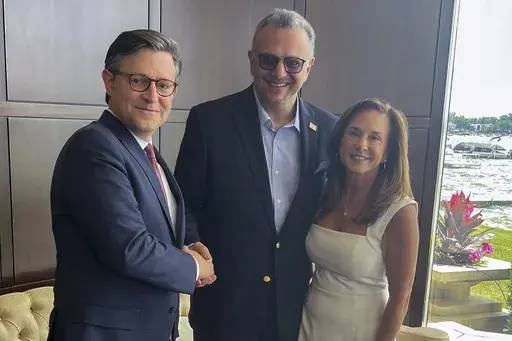 This image provided by John Akouri, shows, from left, House Speaker Mike Johnson, R-La., Massad Boulos, Tiffany Trump's father-in-law, and Rep. Lisa McClain, R-Mich., posing for a photo June 1, 2024, in Waterford Township, Mich. Boulos, a Lebanese businessman whose son married Tiffany Trump two years ago is now helping Donald Trump with outreach in the Arab American community. Massad Boulos has traveled to Michigan twice in recent weeks for meetings with nearly 50 members of the Arab American co