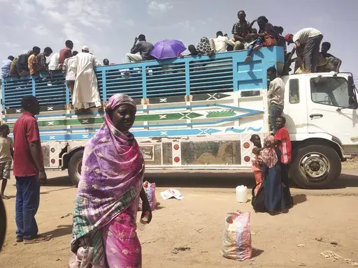 People board a truck as they leave Khartoum, Sudan, on June 19, 2023. Sudan has been torn by war for a year now, torn by fighting between the military and the notorious paramilitary Rapid Support Forces. (AP Photo, File)