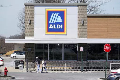 Customers walk into an Aldi supermarket in Bensalem, Pa., March 14, 2022. Discount grocer Aldi said Wednesday, Aug. 16, 2023, that it plans to buy 400 Winn-Dixie and Harveys supermarkets in the southern U.S. (AP Photo/Matt Rourke, File)