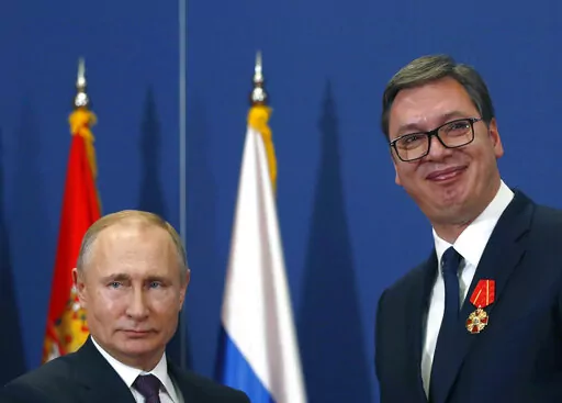 FILE- Russian President Vladimir Putin, left, poses with Serbian President Aleksandar Vucic after being awarded the Order of Alexander Nevsky in Belgrade, Serbia, Thursday, Jan. 17, 2019. Vucic said he has secured an "extremely favorable" gas deal with Russia during his telephone conversation with Vladimir Putin on Sunday, May 29, 2022. The Serbian populist president has announced that he has secured an “extremely favorable” gas deal with Russia. Serbian President Aleksandar Vucic, a former 
