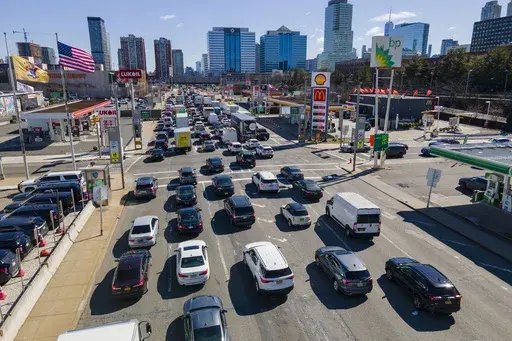 Commuters wait to drive through the Holland Tunnel into New York City during morning rush hour traffic, in Jersey City, N.J., March 8, 2023. (AP Photo/Ted Shaffrey, File)