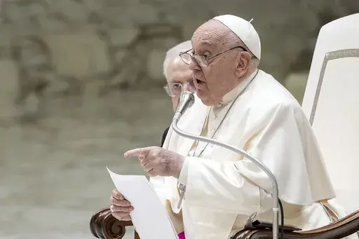 Pope Francis exchanges the season's greetings with Vatican employees, in the Paul VI Hall at the Vatican, Saturday, Dec. 21, 2024. (AP Photo/Andrew Medichini)