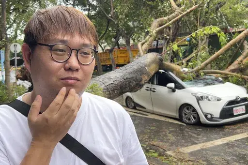 Song Zi-jie, 28 years old ride-hailing service driver, talks about his experience a day after a tree collapsed on his car while he was inside as Typhoon Kong-rey sweeps through Taipei, Taiwan on Friday, Nov. 1, 2024. (AP Photo/Johnson Lai)