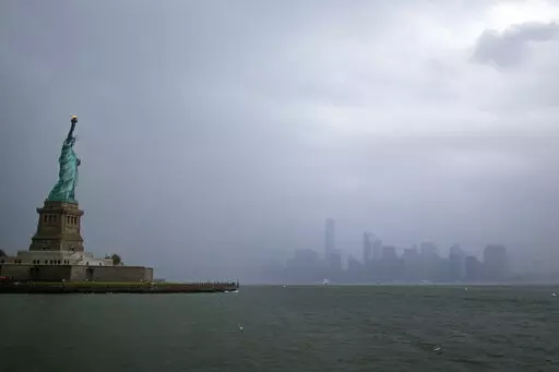The Statue of Liberty is seen with lower Manhattan in the background July 1, 2021, in New York. There are few places in the U.S. with a more deeply ingrained reputation as a refuge for immigrants than New York City, where the Statue of Liberty rises from the harbor as a symbol of welcome for the worn and weary. (AP Photo/Adam Hunger, File)
