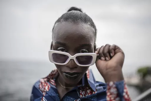 A model presenting dresses by Central African Republic fashion designer Ketura Kimono Milca looks on during the ninth edition of the Liputa fashion show in Goma, Democratic Republic of Congo, Saturday June 24, 2023. The objective of the show, involving designers, models and artists from DRC, Cameroon, Central African Republic, Senegal, Burundi, France, United States and others, is to reveal the latest trends, but also to deliver a message of peace and peaceful coexistence during a period of high
