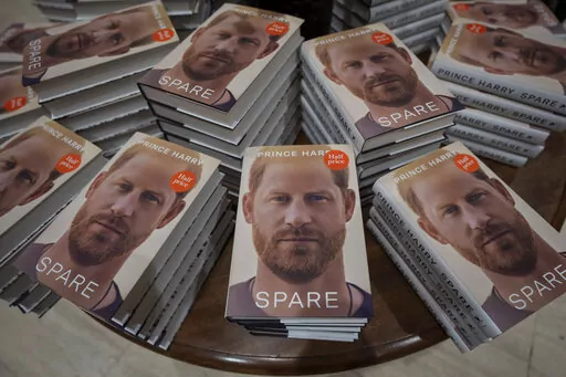 Copies of the new book by Prince Harry called "Spare" are displayed at a book store in London, Jan. 10, 2023. Prince Harry’s explosive memoir, with its damning allegations of a toxic relationship between the monarchy and the press, is likely to accelerate the pace of change already under way within the House of Windsor following the death of Queen Elizabeth II. (AP Photo/Kin Cheung, File)