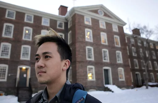In this Feb. 14, 2017 file photo, Viet Nguyen poses for a portrait on the Brown University campus in Providence, R.I. Nguyen, now an alumnus, helped lead an effort urging Brown and other elite universities to rethink their legacy admissions policies. “Now more than ever, there’s no justification for allowing this process to continue,” said Viet Nguyen, a graduate of Brown and Harvard who leads Ed Mobilizer, a nonprofit that has fought legacy preferences since 2018. “No other country in t