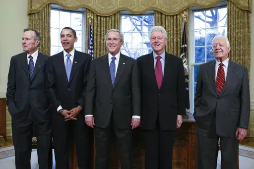 FILE — From left, former President George H.W. Bush, President-elect Barack Obama, President George W. Bush, former President Bill Clinton and former President Jimmy Carter meet in the Oval Office at the White House in Washington, on Jan. 7, 2009. (AP Photo/J. Scott Applewhite, File)