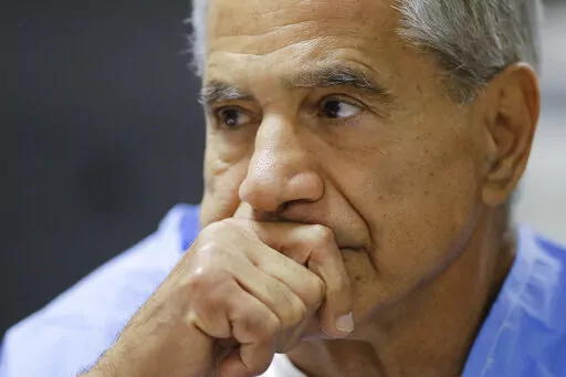 Sirhan Sirhan reacts during a parole hearing on Feb. 10, 2016, at the Richard J. Donovan Correctional Facility in San Diego. California Gov. Gavin Newsom on Thursday, Jan. 13, 2022, rejected releasing Robert F. Kennedy assassin Sirhan Sirhan from prison more than a half-century after the 1968 slaying left a deep wound during one of America’s darkest times. (AP Photo/Gregory Bull, Pool, File)