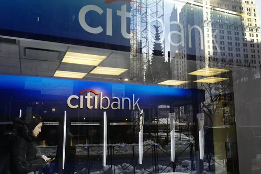 In this March 16, 2017, file photo, a customer enters a Citibank branch, in New York. Citigroup intentionally discriminated against Armenian Americans when they applied for credit cards, the Consumer Financial Protection Bureau said Wednesday, Nov. 8, 2023. (AP Photo/Mark Lennihan, File)