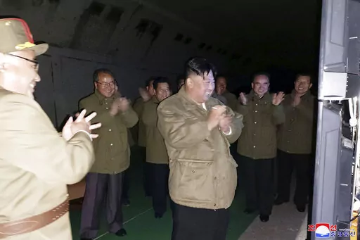 In this photo provided by the North Korean government, North Korean leader Kim Jong Un, center, supervises tests of long-range cruise missiles at an undisclosed location in North Korea Wednesday, Oct. 12, 2022. Independent journalists were not given access to cover the event depicted in this image distributed by the North Korean government. The content of this image is as provided and cannot be independently verified. Korean language watermark on image as provided by source reads: "KCNA" which i