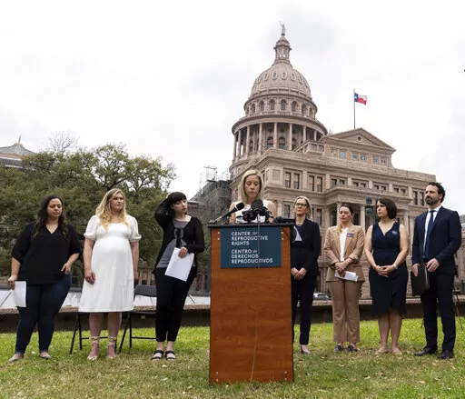 Amanda Zurawski, one of five plaintiffs in Zurawski v. State of Texas, speaks in front of the Texas State Capitol in Austin, Texas, Tuesday, March 7, 2023, as the Center for Reproductive Rights and the plaintiffs announced their lawsuit, which asks for clarity in Texas law as to when abortions can be provided under the "medical emergency" exception. All five women were denied medical care while experiencing pregnancy complications that threatened their health and lives. (Sara Diggins/Austin Amer
