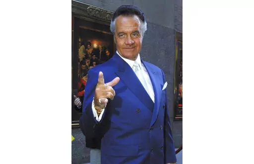 Tony Sirico who plays Paulie Walnuts on the HBO series "The Sopranos" arrives for the premiere of the show's fourth season in this Thursday, Sept. 5, 2002, at New York's Radio City Music Hall. Sirico, who played the impeccably groomed mobster Paulie Walnuts in “The Sopranos” and brought his tough-guy swagger to films including “Goodfellas,” died Friday, July 8, 2022. He was 79. (AP Photo/Tina Fineberg, File)