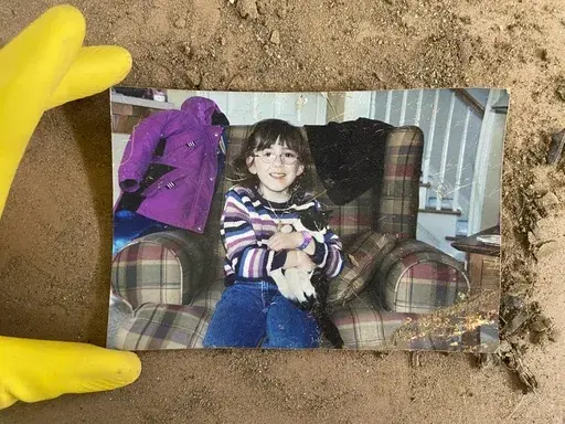 A childhood photo of Samira Zoobi, a 28-year-old who died in Hurricane Helene, was returned to their parents. (Taylor Schenker via AP)