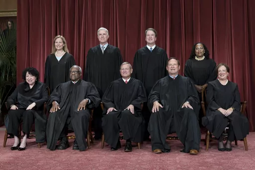 Members of the Supreme Court sit for a new group portrait following the addition of Associate Justice Ketanji Brown Jackson, at the Supreme Court building in Washington, Oct. 7, 2022. Bottom row, from left, Justice Sonia Sotomayor, Justice Clarence Thomas, Chief Justice John Roberts, Justice Samuel Alito, and Justice Elena Kagan. Top row, from left, Justice Amy Coney Barrett, Justice Neil Gorsuch, Justice Brett Kavanaugh, and Justice Ketanji Brown Jackson. The Supreme Court is adopting its first
