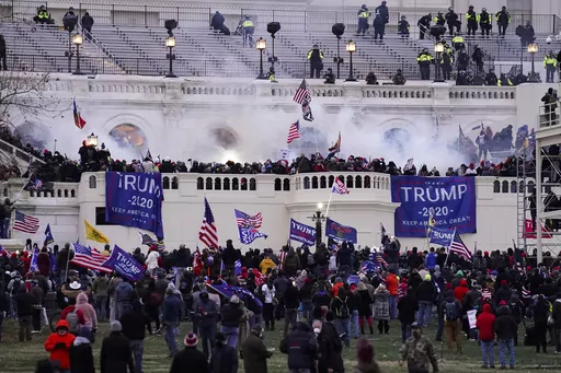 Violent rioters loyal to President Donald Trump storm the Capitol in Washington on Jan. 6, 2021. Lawsuits playing out in two states this week seeking to keep former President Donald Trump off the ballot rely on a constitutional clause barring those from office who “have engaged in insurrection.” One challenge has become clear during the hearings in Colorado and Minnesota: No one can agree on how to define an insurrection. (AP Photo/John Minchillo, File)