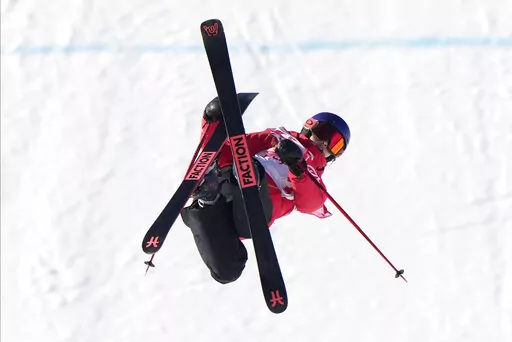 China's Eileen Gu competes during the women's slopestyle qualification at the 2022 Winter Olympics, Monday, Feb. 14, 2022, in Zhangjiakou, China. (AP Photo/Francisco Seco)