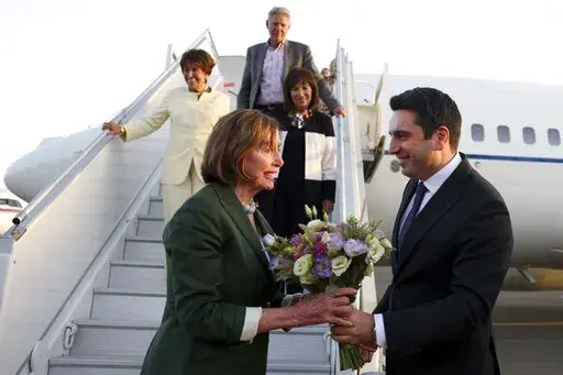 CORRECTS CREDIT - In this handout photo released by Armenian National Assembly via Photolure photo agency, Head of Armenian National Assembly Alen Simonyan, right, welcomes U.S. House of Representatives Nancy Pelosi upon her arrival at the International Airport outside of Yerevan, Armenia, Saturday, Sept. 17, 2022. A US Congressional delegation headed by Speaker of the House Nancy Pelosi arrived Saturday in Armenian, where a cease-fire has held for three days after an outburst of fighting with n