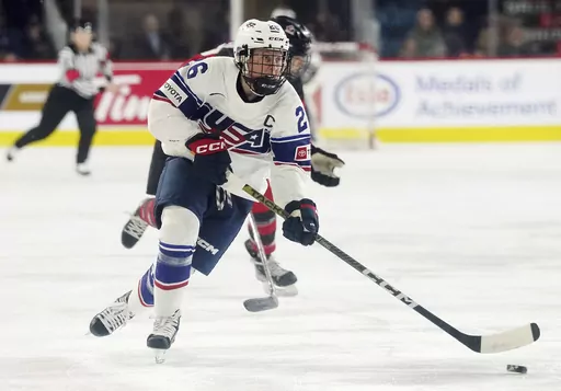 United States' Kendall Coyne Schofield skates with the puck against Canada during the first period of a Rivalry Series hockey game Nov. 17, 2022, in Kamloops, British Columbia. Coyne Schofield, a three-time Olympian and former U.S. captain, will suit up for Minnesota’s Professional Women's Hockey League opener at Boston on Jan. 3. The game will underline Coyne Schofield’s determination in returning to competitive play, after the birth of her son, now 6 months old. (Jesse Johnston/The Canadia