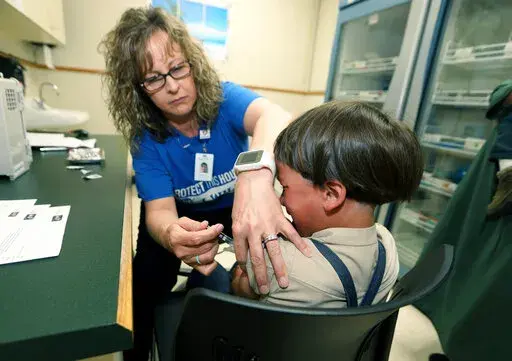 A registered nurse and immunization outreach coordinator with the Knox County Health Department, administers a vaccination to a kid at the facility in Mount Vernon, Ohio, Friday May 17, 2019. In a report issued Wednesday, Nov. 23, 2022, the World Health Organization and the U.S. Centers for Disease Control and Prevention say measles immunization has dropped significantly since the coronavirus pandemic began, resulting in a record high of nearly 40 million children missing a vaccine dose last yea