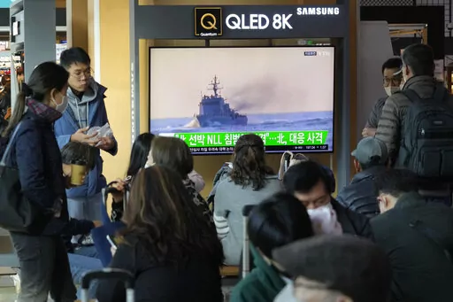 A TV screen shows a file image of a South Korean navy vessel during a news program at the Seoul Railway Station in Seoul, South Korea, Monday, Oct. 24, 2022. The rival Koreas exchanged warning shots along their disputed western sea boundary on Monday, their militaries said, amid heightened animosities over North Korea's recent barrage of weapons tests. (AP Photo/Ahn Young-joon)