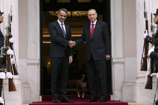 Greece's Prime Minister Kyriakos Mitsotakis, left, welcomes the Turkey's President Recep Tayyip Erdogan before their meeting at Maximos Mansion in Athens, Greece, Thursday, Dec. 7, 2023. Old foes Turkey and Greece will test a five-month-old friendship initiative on Monday, May 13, 2024 when Greek Prime Minister Kyriakos Mitsotakis visits Ankara. (AP Photo/Thanassis Stavrakis, File)