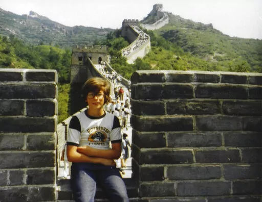 This photo provided by Ted Anthony shows him at the age of 11 sitting on a section of the Great Wall outside Beijing in fall 1979. The photo was taken by his father Edward Mason Anthony. For one 11-year-old American boy, Richard Nixon's trip to China changed almost everything. In 1979, Ted Anthony was part of the earliest wave of American families to come to Beijing after relations were established thanks to the 1972 meeting between Nixon and Mao Zedong. Now an Associated Press journalist, he sa