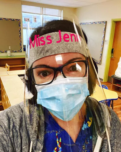 This undated photo shows special education teacher Jennifer Graves, at Dr. Reginald Mayo Early Childhood School, in New Haven, Conn. When her classroom aide didn't show up for work and no substitutes were available for the day because staffing levels have been decimated by the surge in COVID-19 infections, she borrowed paraprofessionals from other classrooms for short stretches to get through. (Courtesy Jennifer Graves via AP)