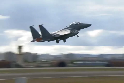 In this image taken from video, South Korean Air Force's F15K fighter jet takes off Tuesday, Oct. 4, 2022, in an undisclosed location in South Korea. South Korea says North Korea flew 12 warplanes near their mutual border on Thursday, Oct. 6, 2022, prompting South Korea to scramble 30 military planes in response. (South Korean Defense Ministry via AP)