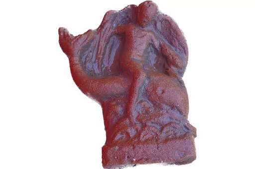 This undated photo shows a terracotta figurine of Eros riding a dolphin found in a newly discovered sanctuary, which dates from the 5th century B.C., that was first identified in 2019 along the ancient city walls of Paestum, Southern Italy. The excavations of the sanctuary in the ancient city of Paestum have unearthed seven terracotta bull heads and a figurine of Eros riding a dolphin that shines new light on the religious life and rituals of the ancient Greek city, culture ministry officials sa