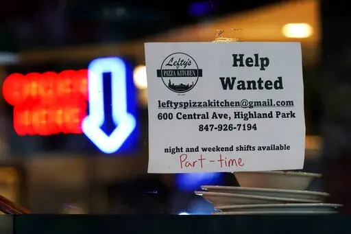 Hiring sign is displayed at a restaurant in Highland Park, Ill., Thursday, July 14, 2022. Fewer Americans filed for unemployment benefits last week as the labor market continues to shine despite weakening elements of the U.S. economy. Applications for jobless aid for the week ending Aug. 27, fell by 5,000 to 232,000, the Labor Department reported Thursday, Sept. 1.  (AP Photo/Nam Y. Huh)
