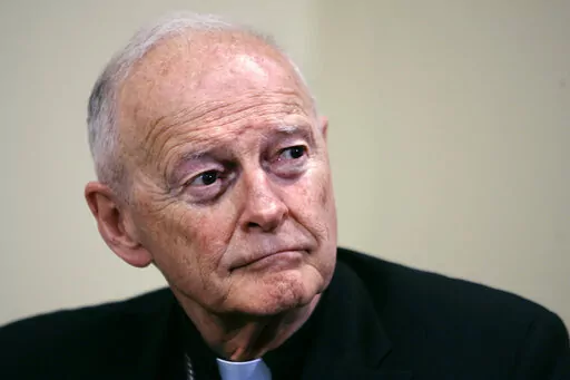 Former Washington Archbishop, Cardinal Theodore McCarrick listens during a press conference in Washington, May 16, 2006. Lawyers for former Roman Catholic Cardinal McCarrick filed a motion Monday, Feb. 27, 2023, to dismiss a case charging him with sexually assaulting a boy decades ago, saying the 92-year-old once-powerful American prelate has dementia and is not competent to stand trial. (AP Photo/J. Scott Applewhite, File)