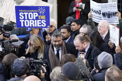 Lawyer Tofique Hossain addresses the media outside the Supreme Court in London, Wednesday, Nov. 15, 2023. Britain's Supreme Court has ruled that the government's contentious plan to send some migrants on a one-way trip to Rwanda is illegal. Five justices on the country's top court said Wednesday that asylum-seekers would be "at real risk of ill-treatment" because they could be sent back to their home countries once they were in Rwanda.The ruling is a major blow to a key government policy that ha