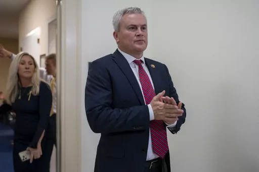 House Oversight and Accountability Committee Chairman James Comer, R-Ky., emerges from the committee room, followed by Rep. Marjorie Taylor Greene, R-Ga., to speak to reporters after Hunter Biden, President Joe Biden's son, defied a congressional subpoena to appear privately for a deposition before Republican investigators who have been digging into his business dealings, at the Capitol in Washington, Wednesday, Dec. 13, 2023. (AP Photo/J. Scott Applewhite, File)