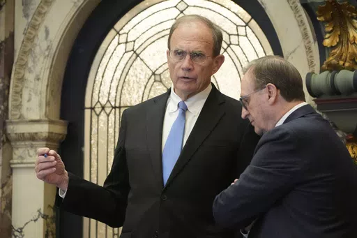 Mississippi Republican Lt. Gov. Delbert Hosemann, left, confers with Mississippi Senate President Pro Tempore Dean Kirby, R-Pearl, during floor debate on general bills, Wednesday, March 13, 2024, at the Mississippi State Capitol in Jackson. (AP Photo/Rogelio V. Solis)