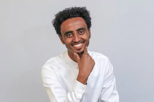 Freelance video journalist Amir Aman Kiyaro, who is accredited to The Associated Press and has been in detention since November 2021 without charges, poses for a photograph in Ethiopia on Oct. 17, 2021. Kiyaro was freed on bail Friday, April 1, 2022 after the country's Supreme Court on Thursday upheld the ruling to grant him bail, rejecting a police effort to block his release. (AP Photo, File)